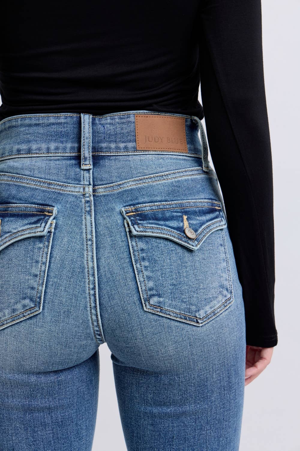 High Waisted Flare with Buttoned Back Pockets
